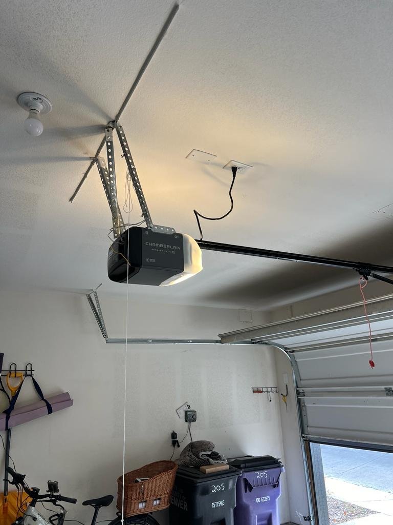 Garage door hardware inspected during a residential repair