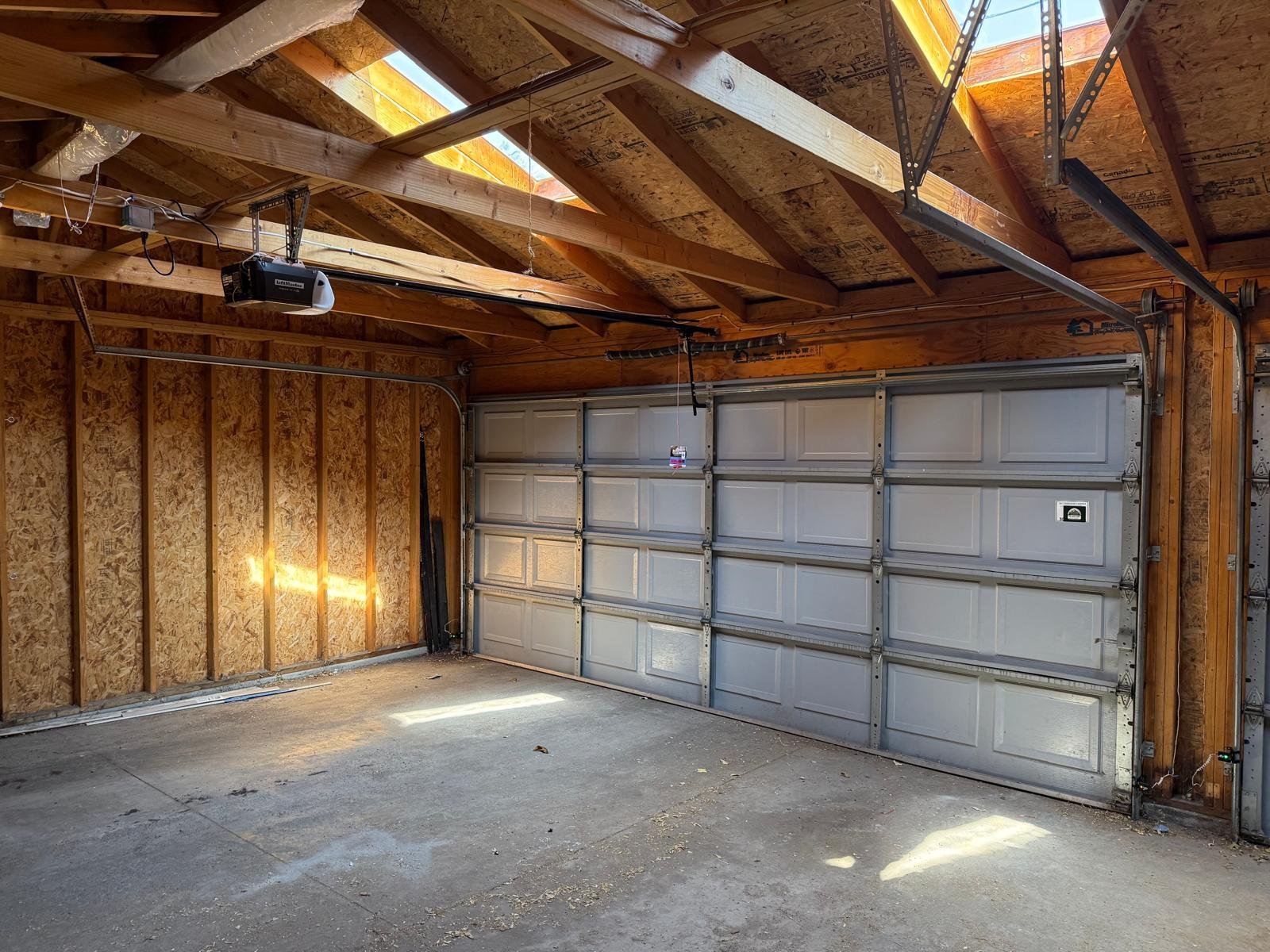 Technician installing a residential garage door opener