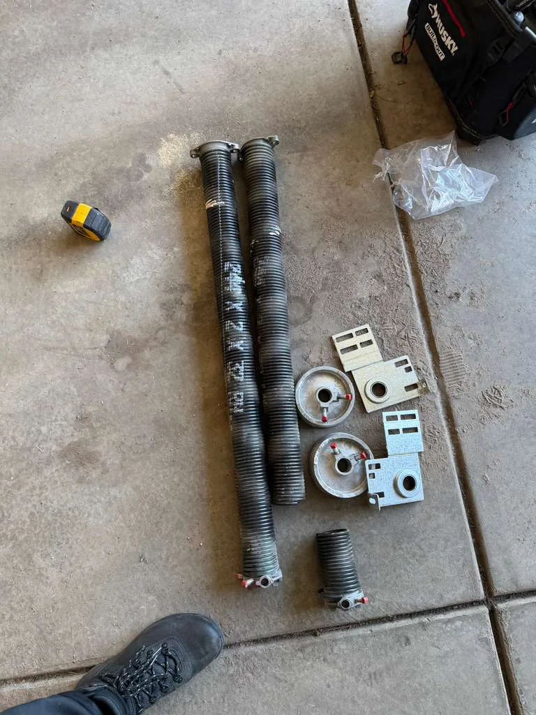 Garage door springs and related hardware arranged for inspection